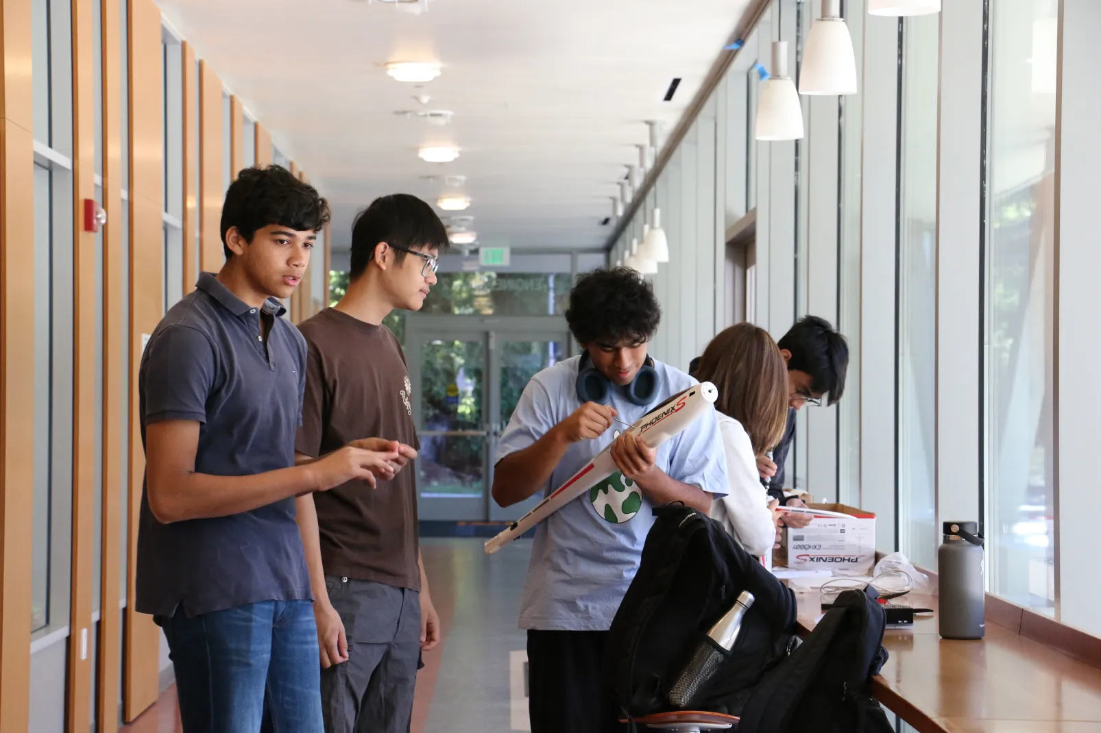 Club members assembling the glider in the engineering hallway